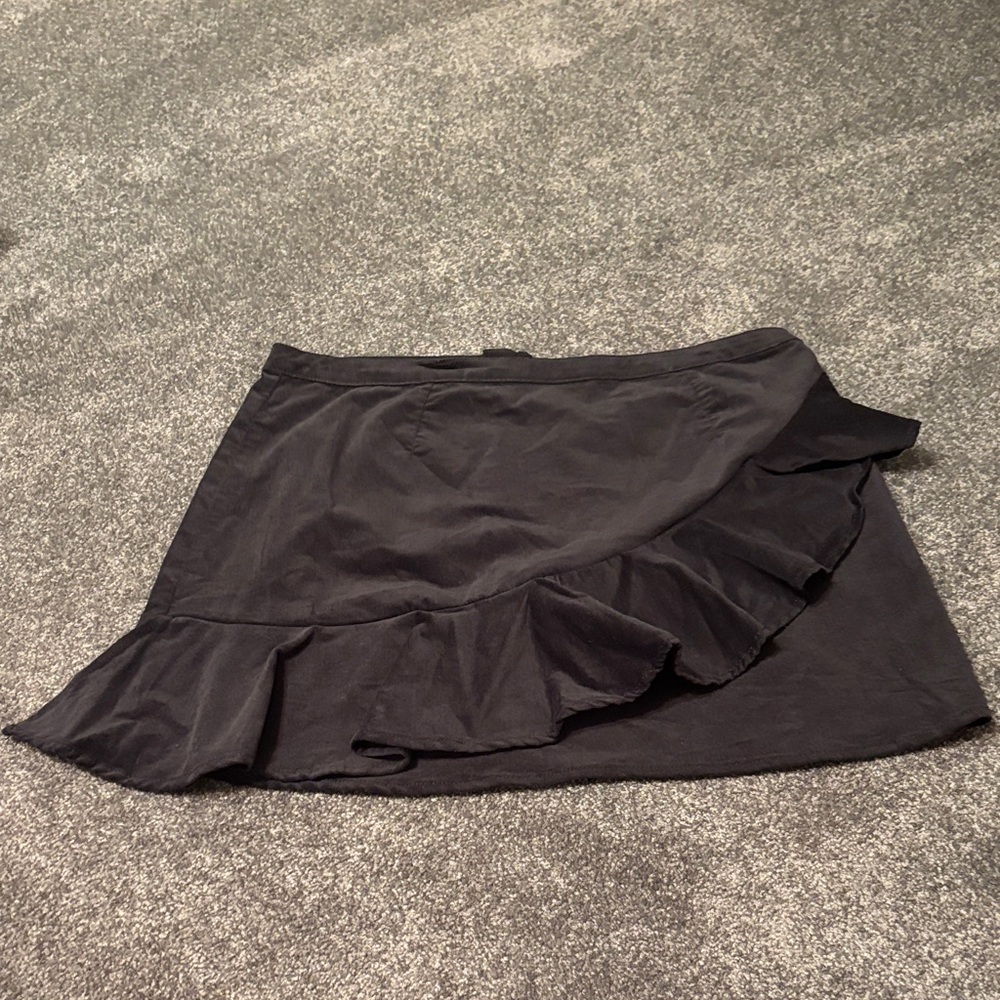 Beautiful BP black velvet mini skirt with front ruffle . Unlined back zip.